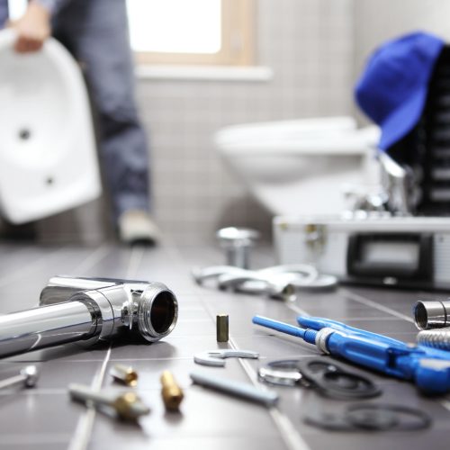 Plumber,At,Work,In,A,Bathroom,,Plumbing,Repair,Service,,Assemble